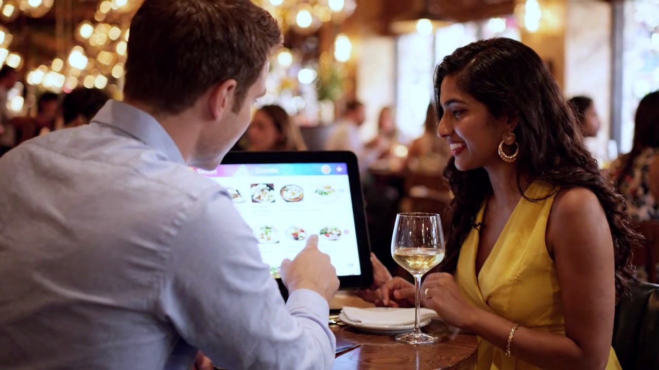 Guest viewing a digital menu at the table